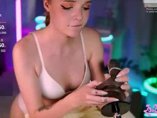 fluffyellie spanked cam girl squirts in her own face from machine fucking on camera